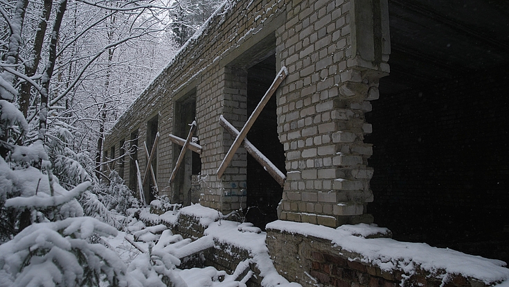 War Ukraine long brick corridor with snow outside